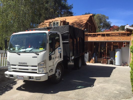 Photo of Customized Hauling - Junk Removal - Novato, CA, US. We demolished this entire garage and upstairs area in Corte Madera