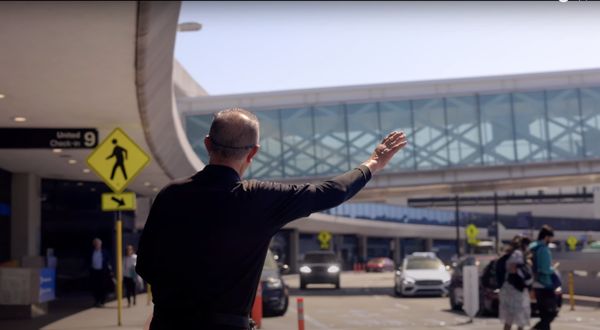 Photo of SFO Valet Service - Burlingame, CA, US. Valet attendant waving down car