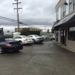 Photo of Grand Performance Auto Centre - Richmond, BC, Canada. Front entrance. Look at the high end Porsches, Marserati waiting to be serviced...