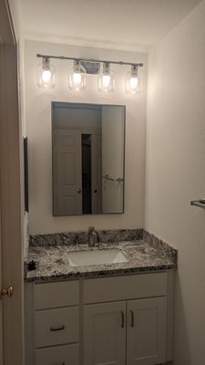 Photo of A Tamam Construction - South San Francisco, CA, US. New vanity, light fixture and mirror