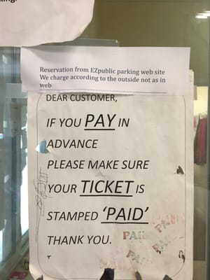 Photo of EZ Public Parking - San Francisco, CA, US. This small paper says that your reservation from their website doesn't mean anything to them. And they can charge you more.