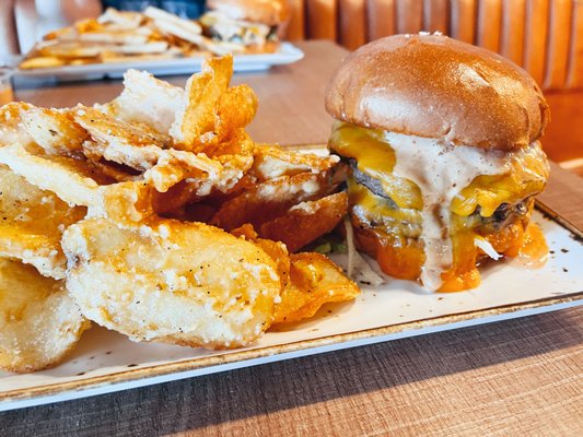 Photo of Vonns - Vancouver, BC, CA. a cheeseburger with fries on a plate