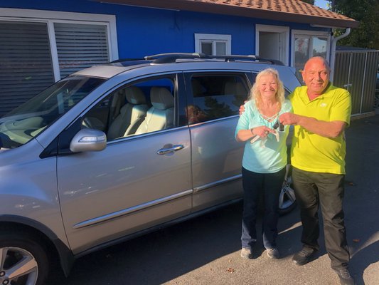 Photo of Pacific Bay Auto - Fremont, CA, US. Jason on the right and my girlfriend's mom on the left with our recently purchased 2010 Acura MDX