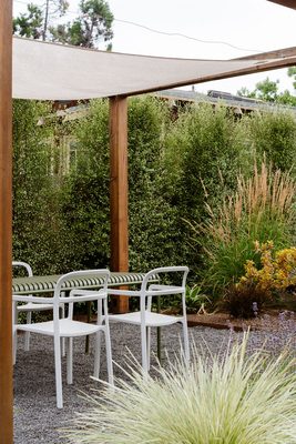 Photo of Terra Gardens - Berkeley, CA, US. a pergolated patio with a table and chairs