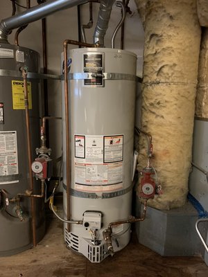 Photo of Pipeline Plumbing - San Francisco , CA, US. Old water heater out and new water heater in with recirculating line reconnected.