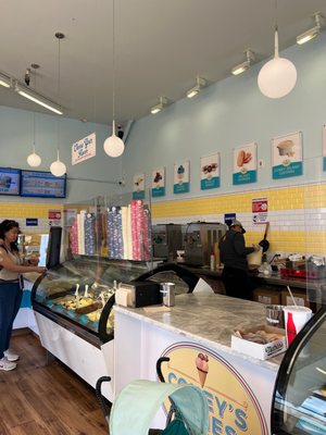 Photo of Coney's Cones - Brooklyn, NY, US. a woman standing in front of the counter