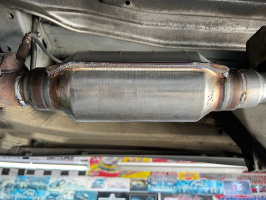 Photo of South City Muffler - South San Francisco, CA, US. The new after-market catalytic converter installed.