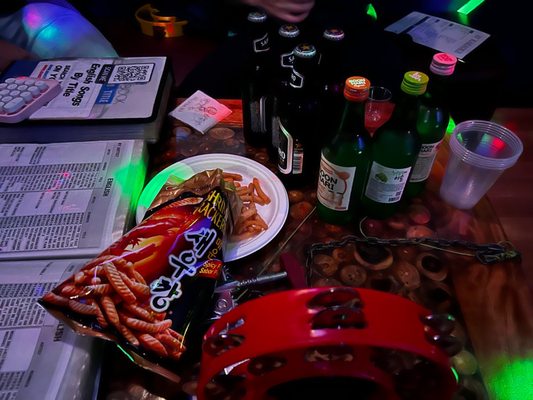 Photo of 32 Karaoke - New York, NY, US. a table full of snacks and drinks