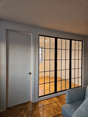 Photo of 1DayWall - New York, NY, US. Black factory windows with custom door. (Different angle)