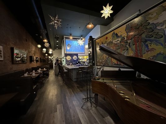 Photo of Tekkaba - Vancouver, BC, CA. a grand piano in a restaurant