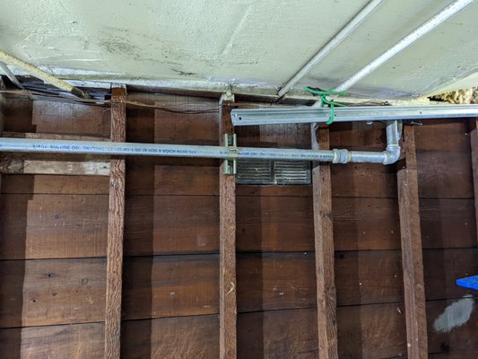 Photo of Discount Plumbing Rooter - Burlingame, CA, US. Before - gas lines in the way of garage door track