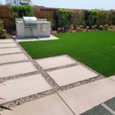 Transform your yard into an awesome hangout spot. Enjoy your personal outdoor kitchen with a beautiful artificial grass and concrete walkway