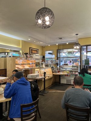 Photo of Wah Lai Yuen - Victoria, BC, CA. people sitting at tables in a restaurant