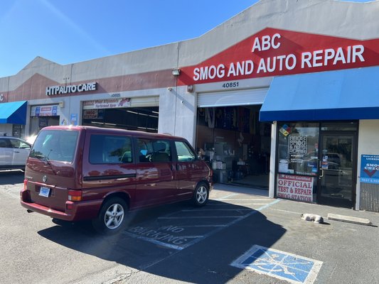 Photo of ABC Smog & Auto Repair - Fremont, CA, US. My new/old Eurovan about to get smog checks. Notice the sweet 'shop dog' by the curb who posed