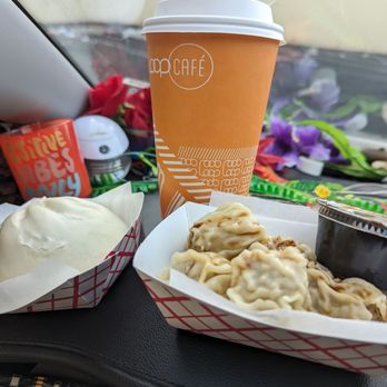 Siopao to the left, & Food on the right - Siomai Dimsum  Coffee in the middle?