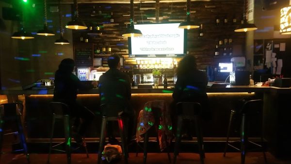 Photo of Beats Karaoke - Brooklyn, NY, US. three people sitting at a bar