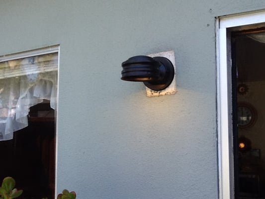 Photo of San Mateo Handyman - San Mateo, CA, US. Exterior light fixture installation in Foster City