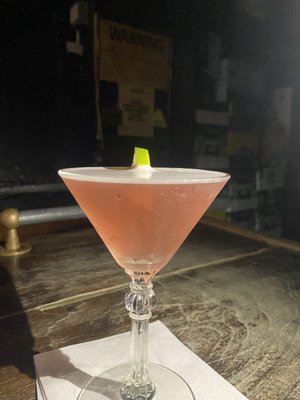 Photo of Brandy's Piano Bar - New York, NY, US. a pink cocktail with a lime garnish