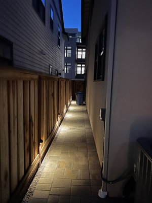Photo of Ideal Landscape & Concrete - Menlo Park, CA, US. a narrow alleyway with lights
