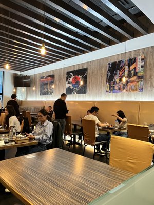 Photo of Kosoo - Vancouver, BC, CA. people sitting at tables in a restaurant