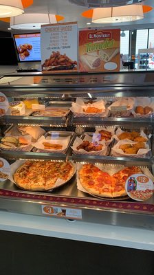 Photo of Loop Neighborhood Market - San Francisco, CA, US. a variety of pizzas on display