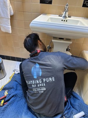 Photo of Plumbing Pure - San Francisco, CA, US. Tom working on sink