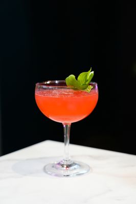 Photo of The Lock & Key Tapas + Bar - Sacramento, CA, US. Try our Kiss & Tell! Made with Tanquerey, St. Germain, Lime, Raspberry, & Mint