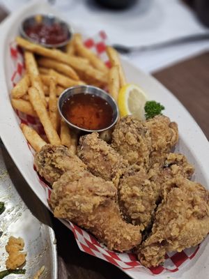 Photo of Bambada - Coquitlam, BC, CA. a plate of fried chicken and french fries
