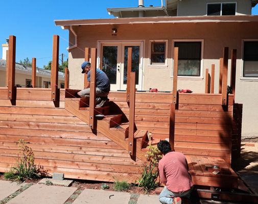 Photo of Terra Gardens - Berkeley, CA, US. two men working on a deck