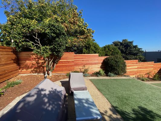 Photo of Logiculture - San Francisco, CA, US. Hortizontal redwood slat fence. We demoed the old fence and replaced it with a more modern look.