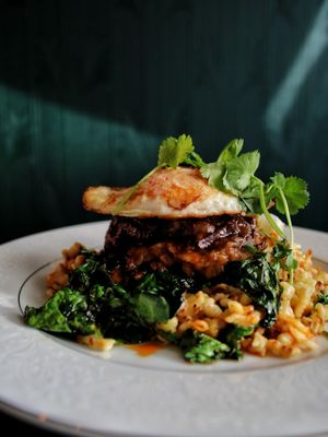 Photo of Maven - Calgary, AB, CA. Lanzhao Braised Beef Cheeks: spiced with anise, clove, ginger, orange peel and braised overnight. Served on mustard spaetzle and arugula