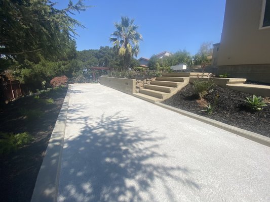 Photo of Liaison Landscapes - San Francisco, CA, US. bocce court with a concrete border and concrete staircase