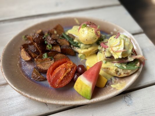 Photo of Yolks - Vancouver, BC, CA. Pork belly Benny with truffle lemon potatoes