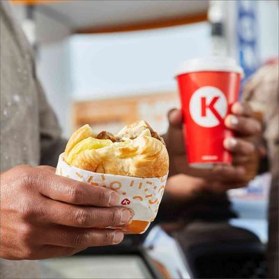 Photo of Circle K - Oak Park, IL, US. a person holding a sandwich and a drink