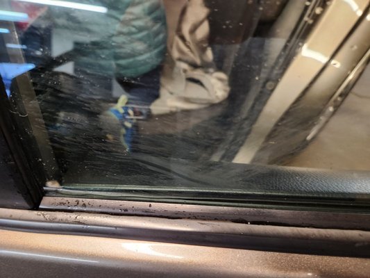 Photo of City Rent-A-Car - San Francisco, CA, US. Back passenger window. Smudges windows. Clearly not recently washed.