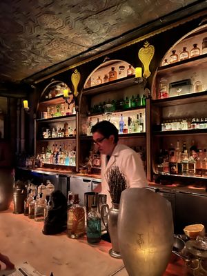 Photo of Apotheke - New York, NY, US. The mixologists dressed in pharmacist-style garb