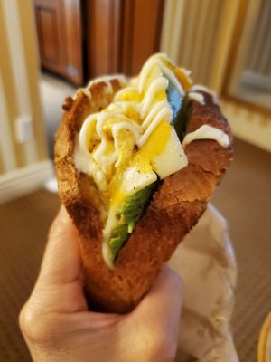 Photo of Bread x Butter Cafe - Vancouver, BC, CA. Avocado-Me Brioche loaf, fresh avocado, scramble eggs, cheddar, kewpie mayo. Yummy