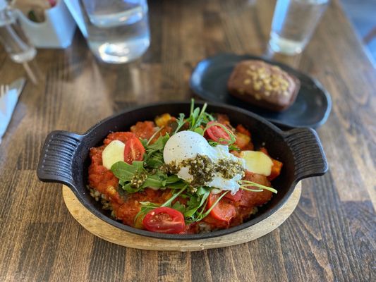 Photo of Breakfast Table - Vancouver, BC, CA. a skillet of food on a wooden table