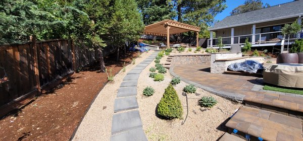 Photo of A Tamam Construction - South San Francisco, CA, US. This backyard has a slope to it so we made a functional backyard, added some gravel, pavers a seating area and a play area for the kiddos!