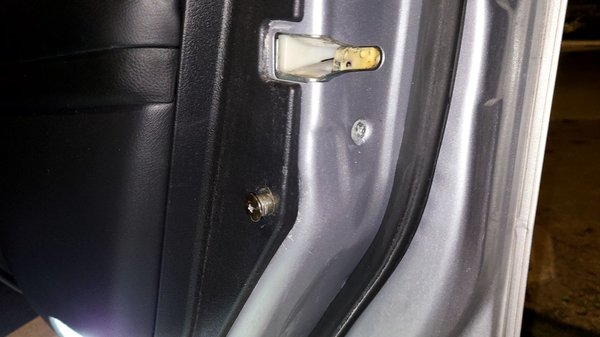 Photo of Mobile Safe Auto Glass - La Mirada, CA, US. Screw is not fixed due to installer broke plastic piece behind it.