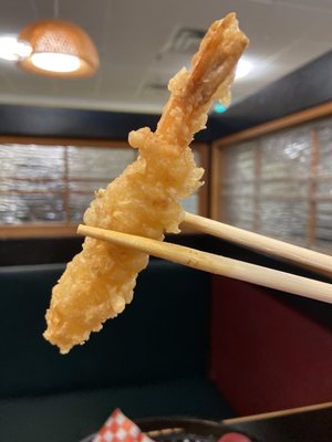 Photo of Hon Sushi - Burnaby, BC, CA. a close up of a piece of food being held by chopsticks