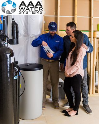 Photo of AAA Water Systems - Concord, CA, US. Water Specialist explaining the functions of a whole home water treatment system. Water Purifier, Filter & Softener.