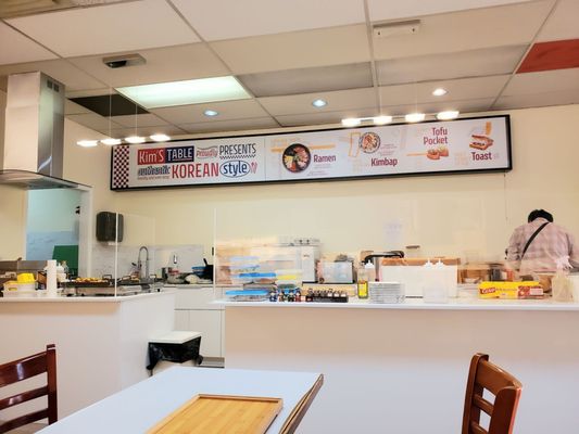 Photo of Tae’s Korean Cuisine - Vancouver, BC, CA. a woman preparing food