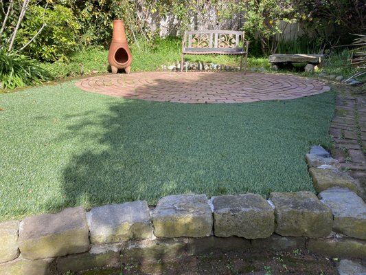 Photo of Blooms Gardening - San Francisco, CA, US. a garden with a brick patio