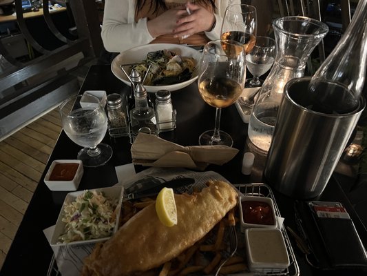 Photo of Finn's Seafood Chops Cocktails - Victoria, BC, CA. a woman sitting at a table