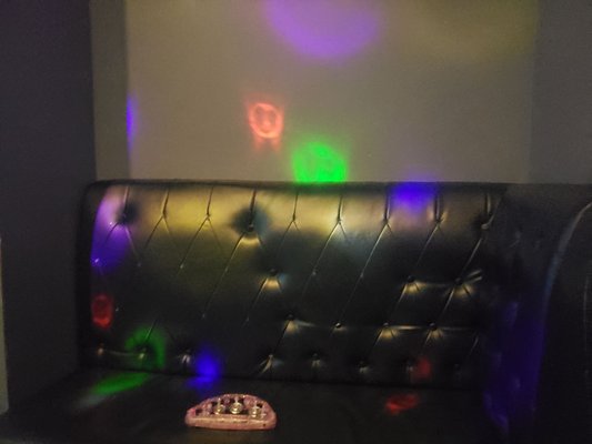 Photo of Karaoke City - New York, NY, US. Couch with free tambourine