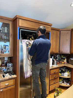 Photo of Azer Appliance & HVAC Repair - Union City, CA, US. Azer Appliance technician checking Freon charge level to confirm the actual cause of the fault warnings.