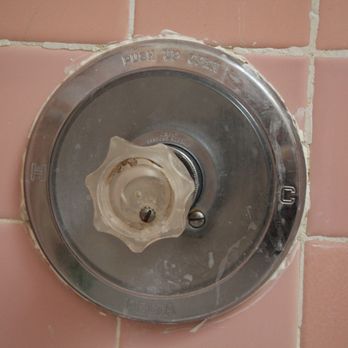 Would you want to tackle a crummy old shower fixture like this by yourself? Not me.