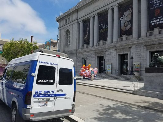 Photo of Blue Shuttle Airporter - San Francisco, CA, US. Blue in front of Asian Museum, Civic Center, San Francisco