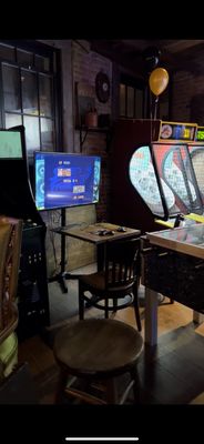 Photo of The Upstairs at 66 - New York, NY, US. a row of arcade machines